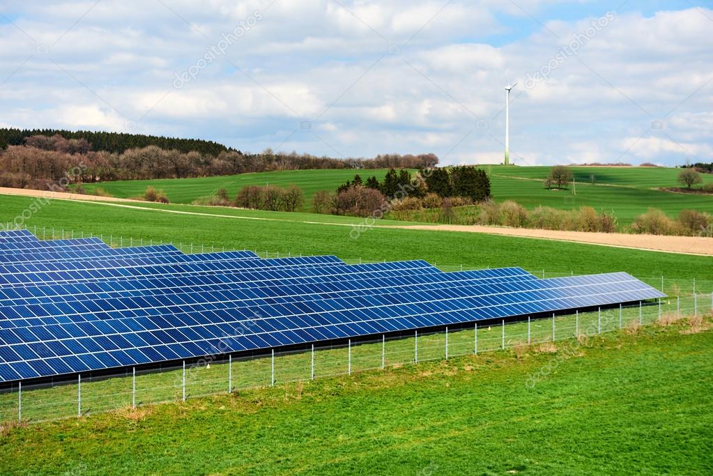 depositphotos_121537668-stock-photo-solar-panels-and-windmill-on